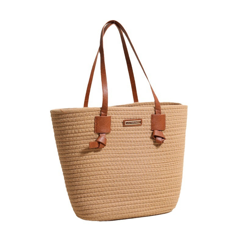 Damen Handtasche aus strukturiertem Naturmaterial mit braunen Lederriemen Karnz