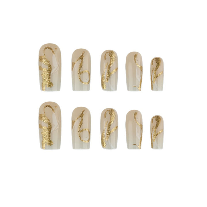 Kunstnägel mit Eleganten Goldakzenten Karnz