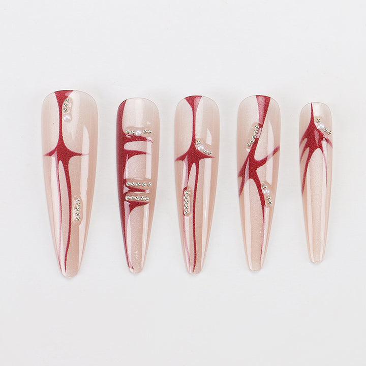 Künstlerische Stiletto Press-On-Nägel mit einzigartigem abstraktem Design Karnz