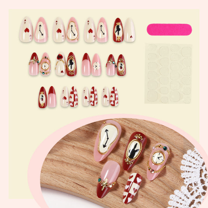 Künstlerisches Press-On-Nagelset mit kreativen Herz- und Uhrendesigns Karnz