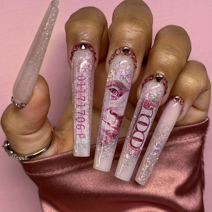 Glamouröses Kunstnagelset mit funkelnden Strass- und Kreuzverzierungen Karnz