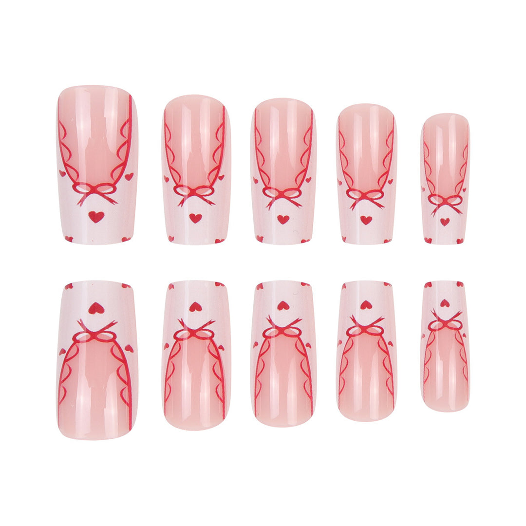 Dekoratives Langes Press-On-Nagelset mit Schleifen- und Herzdesign Karnz