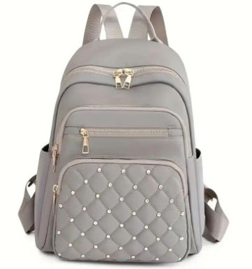 Damen gesteppter Rucksack mit dekorativen Nieten Karnz