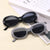 Damen Retro-inspirierte Sonnenbrille mit breitem Rahmen Karnz