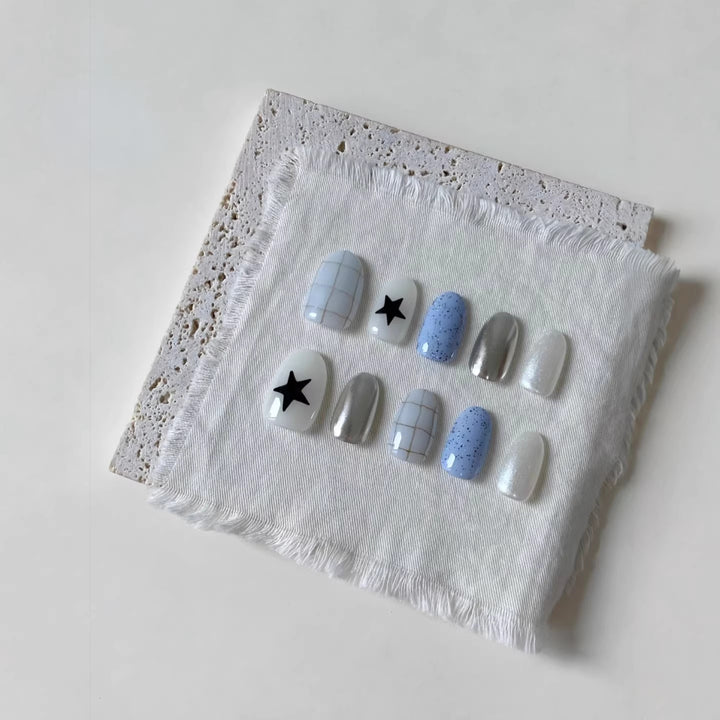 Künstlerisches Press-On-Nagelset mit geometrischen und Sternmustern