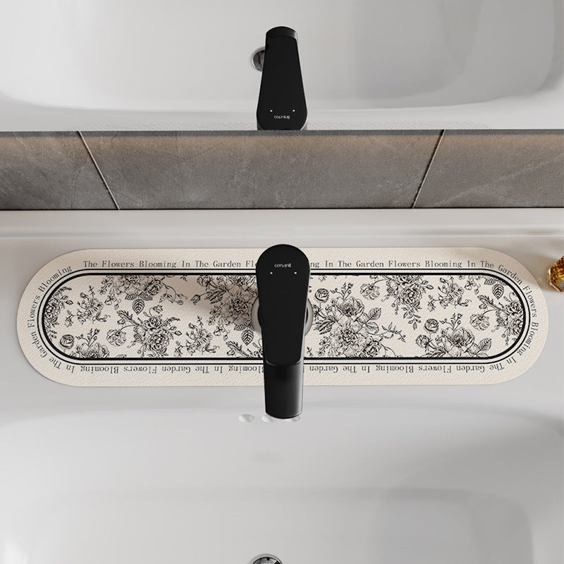Decorative Oval Silicone Faucet Splash Guard Mat with Floral Engraved Print and Non-Slip Backing