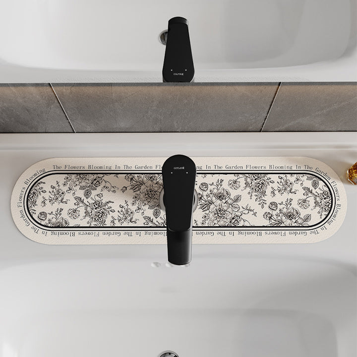 Decorative Oval Silicone Faucet Splash Guard Mat with Floral Engraved Print and Non-Slip Backing