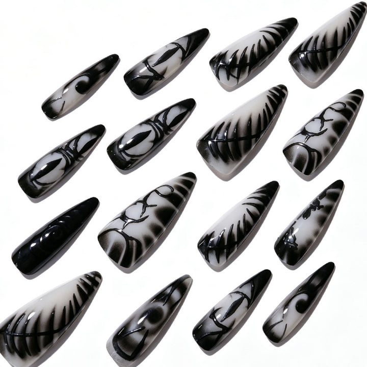 Künstlerisches Stiletto Press-On Nagelset Karnz