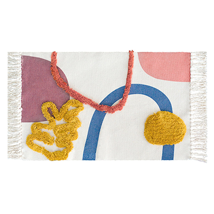 Handgewebter Baumwollläufer mit Pompon‑Tufting und dekorativen Fransen