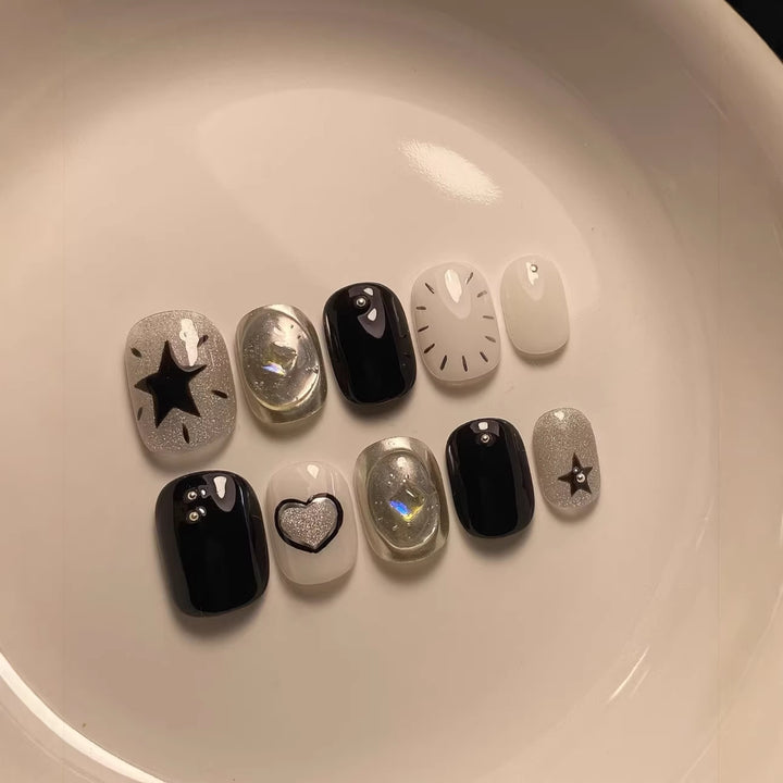 Künstlerisches Press-On-Nagelkunstset mit geometrischen und Sternmustern