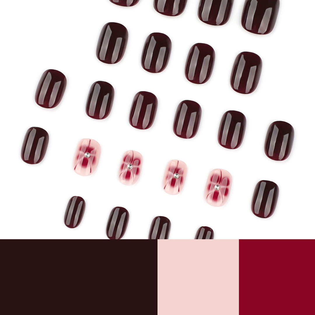 Elegante Nagelkunst mit Glitzer- und Blumenelementen Karnz