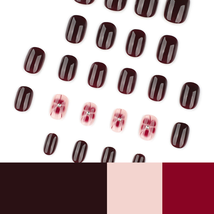 Elegante Nagelkunst mit Glitzer- und Blumenelementen Karnz