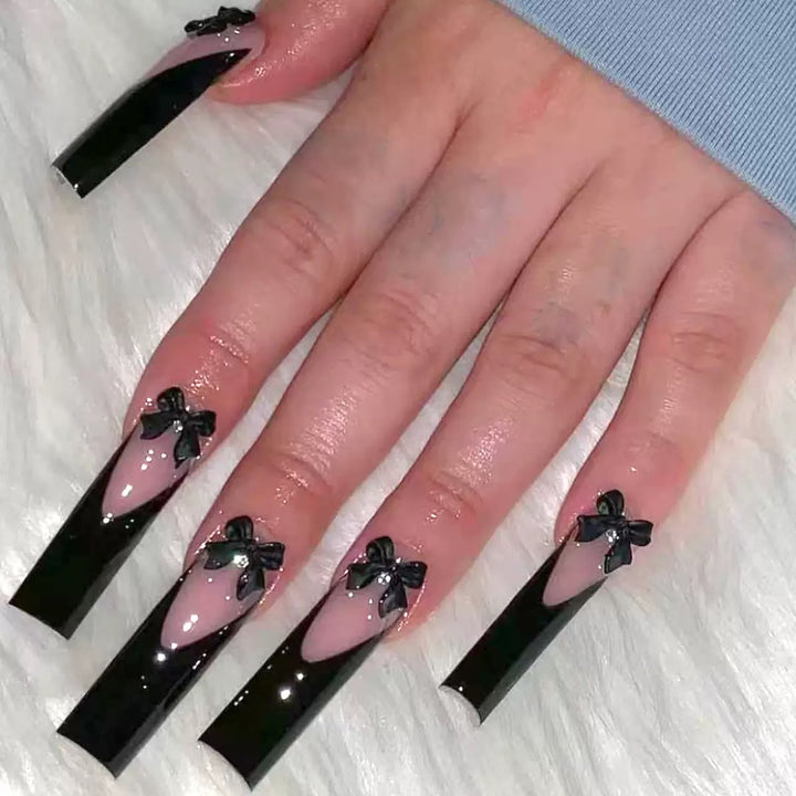 Elegante Kunstnagelspitzen mit Schleifenverzierungen Karnz