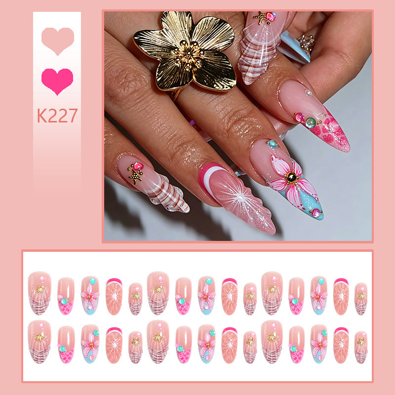 Kunstnagelset mit bunten blühenden 3D-Applikationen Karnz