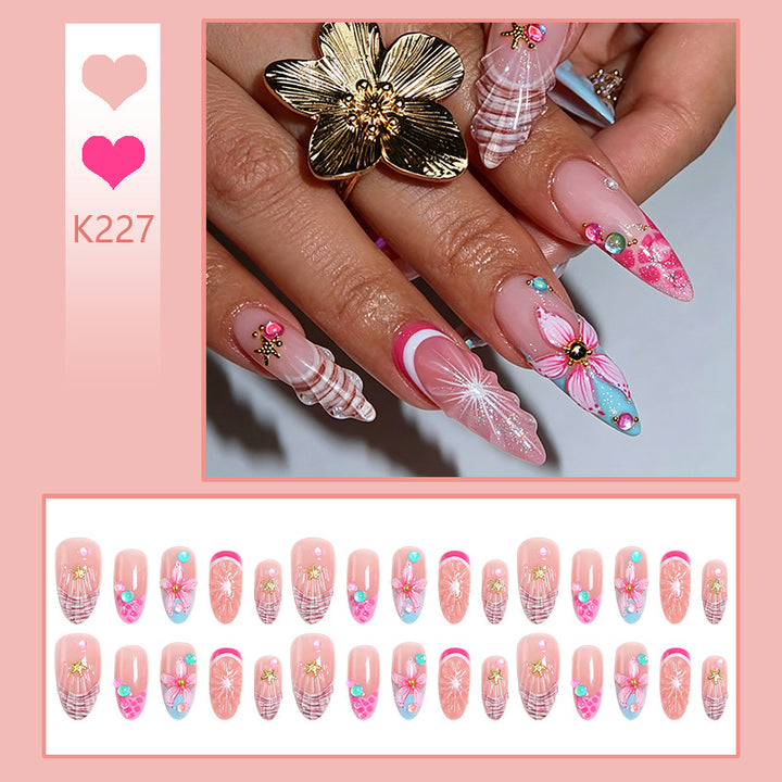 Kunstnagelset mit bunten blühenden 3D-Applikationen Karnz