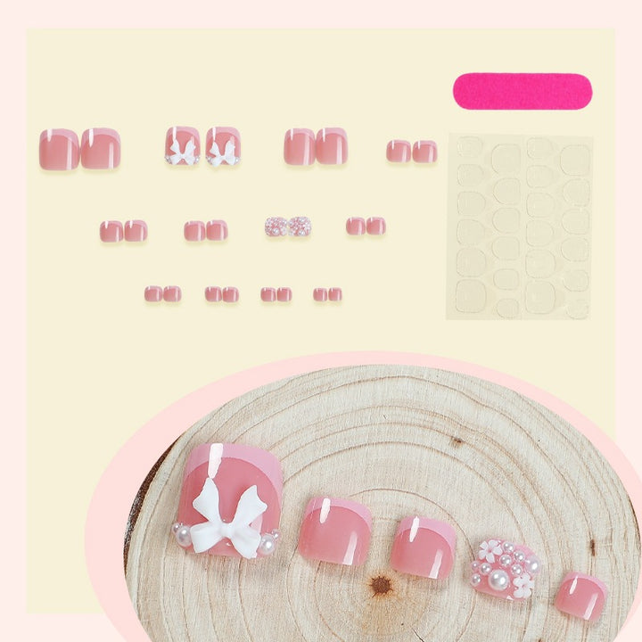 Kunstnagelset mit romantischen Schleifen-Design Karnz