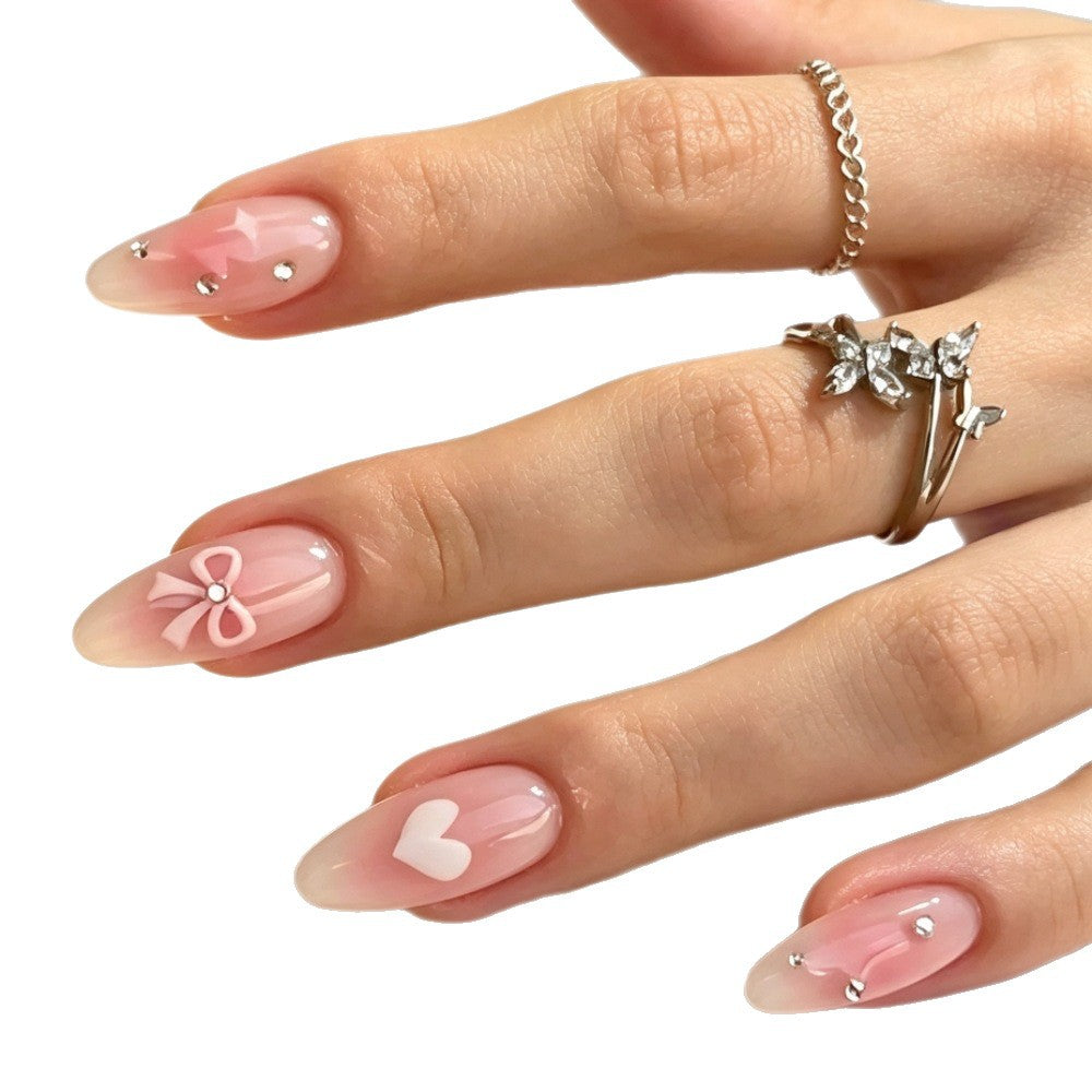 Dekorative Press-On Nagelkunst Set mit Herz- und Schleifendesigns Karnz