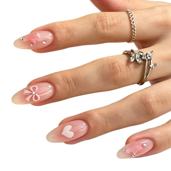 Dekorative Press-On Nagelkunst Set mit Herz- und Schleifendesigns Karnz