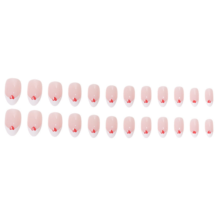Herzgeschmücktes French Tip Nagelset Karnz