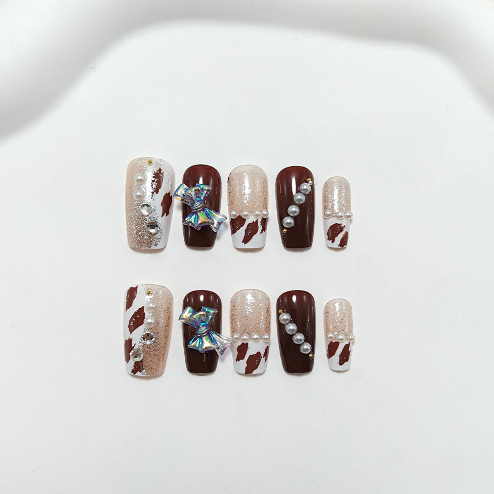 Kunstnägel mit Glamourösem Strass- und Schleifen-Design Karnz