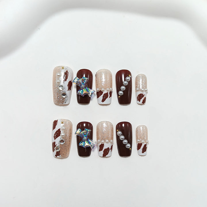 Kunstnägel mit Glamourösem Strass- und Schleifen-Design Karnz
