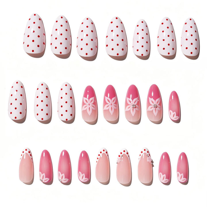 Kunstnagelset mit floralen Akzenten und charmanten Polka-Dots Karnz