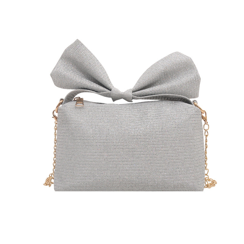 Bogen-accentuierte funkelnde Handtasche