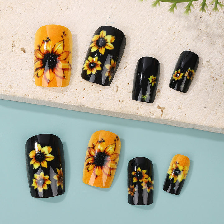 Kunstnägel im floralen Design mit Sonnenblumenmotiv Karnz