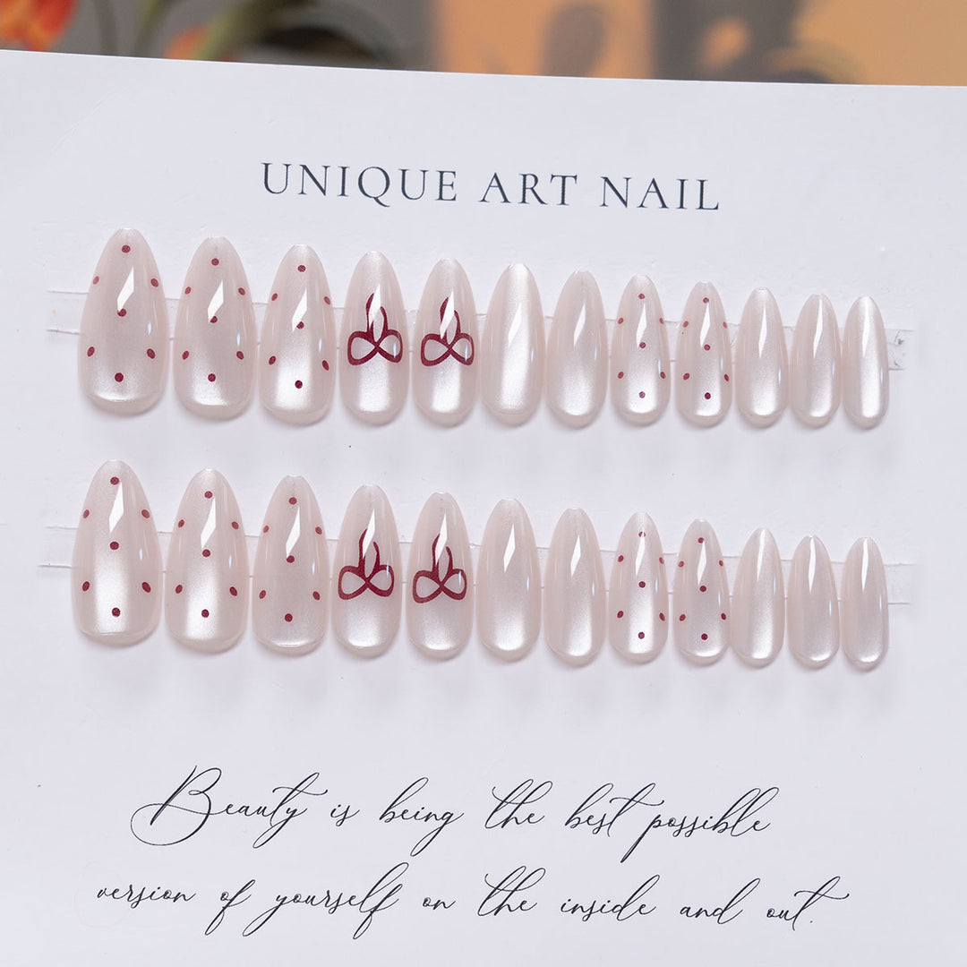 Elegante Stiletto Press-On-Nail-Art mit minimalistischen Schleifen-Design