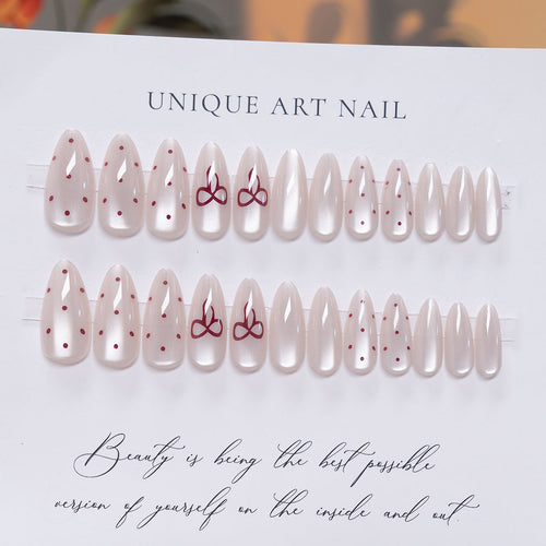 Elegante Stiletto Press-On-Nail-Art mit minimalistischen Schleifen-Design