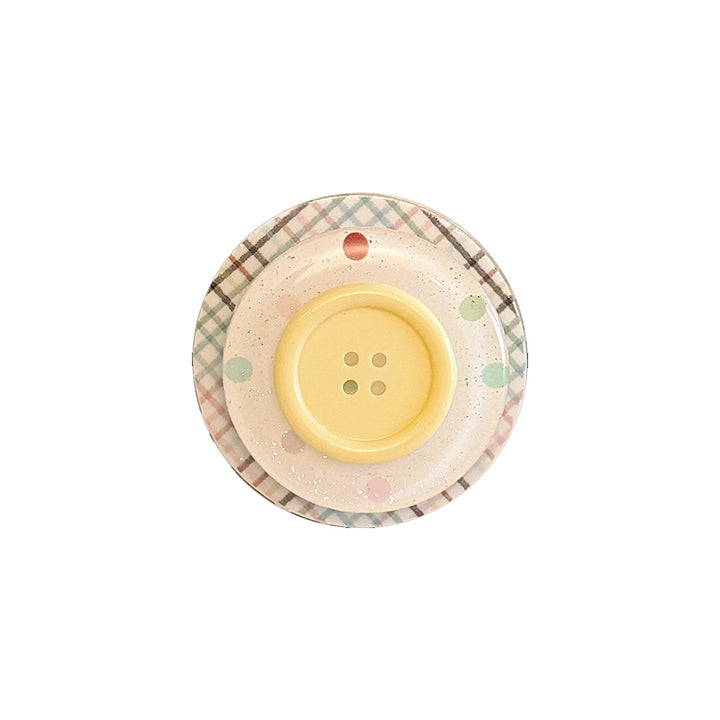 Dekorativer Untersetzer im Button-Design Karnz