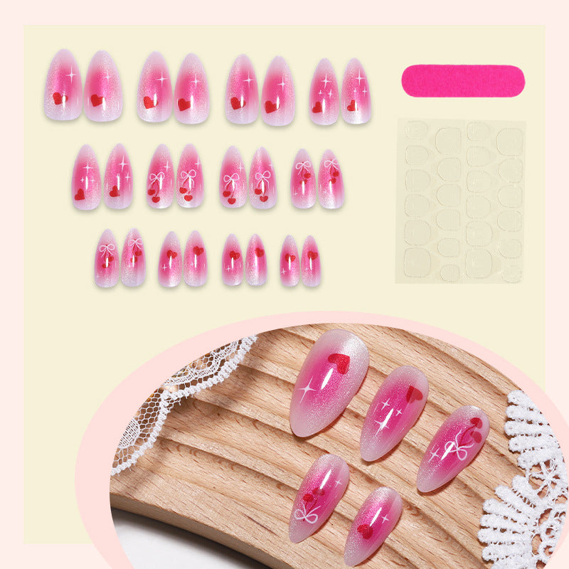 Charmante Acryl Press-On Nägel Set mit Herz- und Schleifenmotiven Karnz