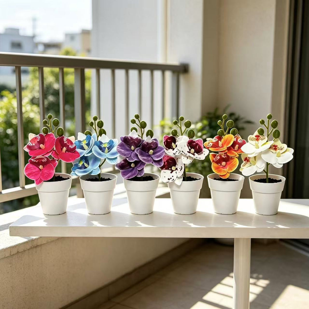 Lebensechte florale Orchideenarrangement für die Wohnkultur