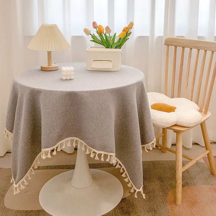Runde strukturierte Tischdecke mit Quastenbesatz und Leinen-ähnlichem Drapierfinish