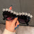 Damen Sonnenbrille mit floralen Kristallakzenten Karnz
