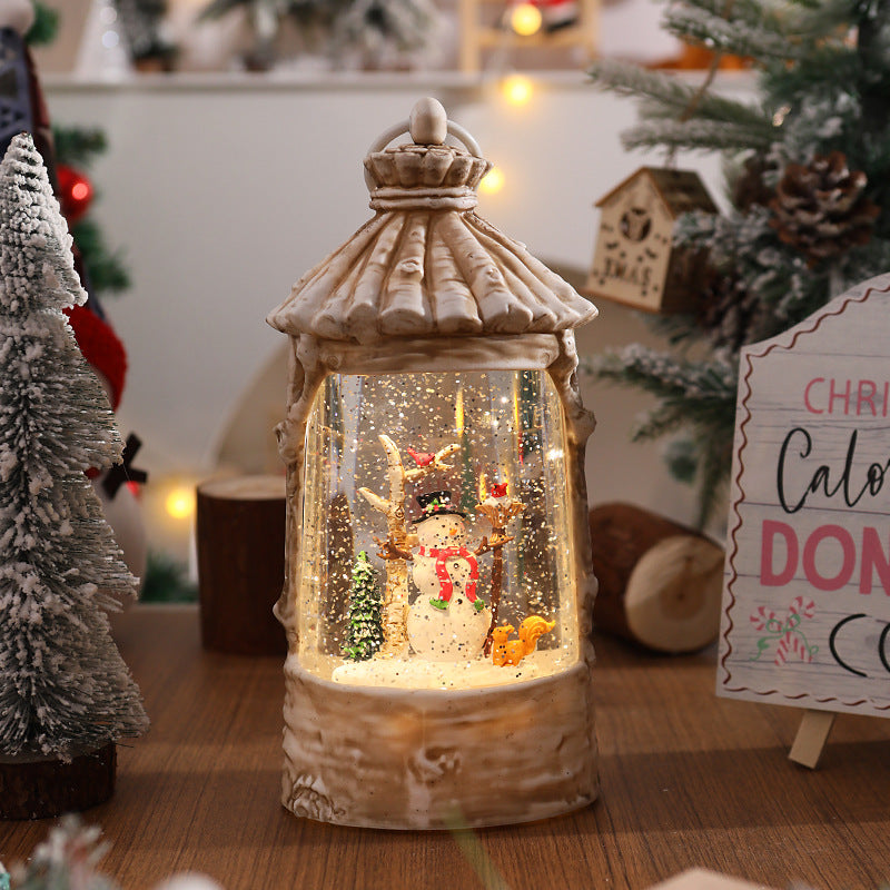 Beleuchtete Weihnachtslaterne mit Schneeszenen Karnz
