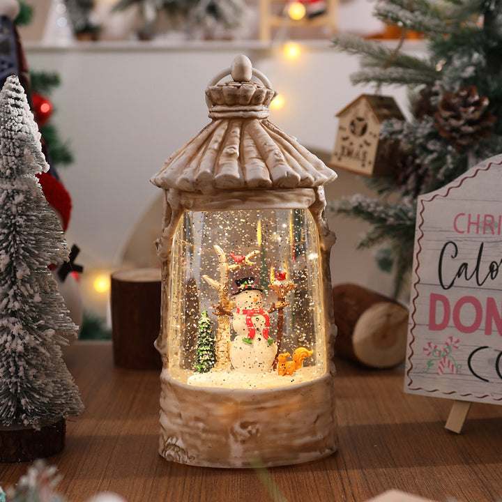 Beleuchtete Weihnachtslaterne mit Schneeszenen Karnz