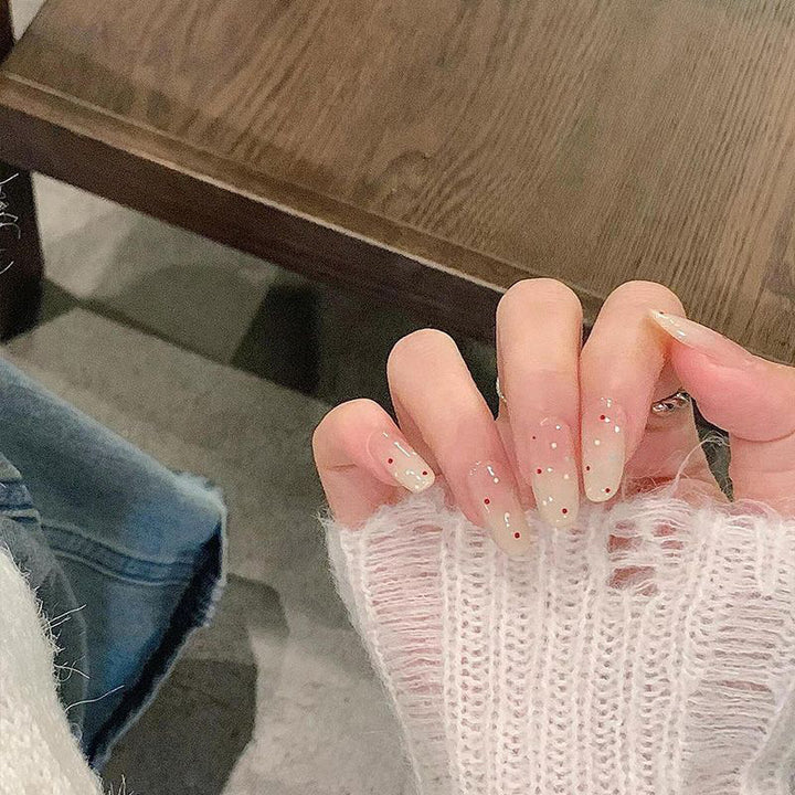 Elegante Druck-Nageltips mit goldenen Akzenten Karnz