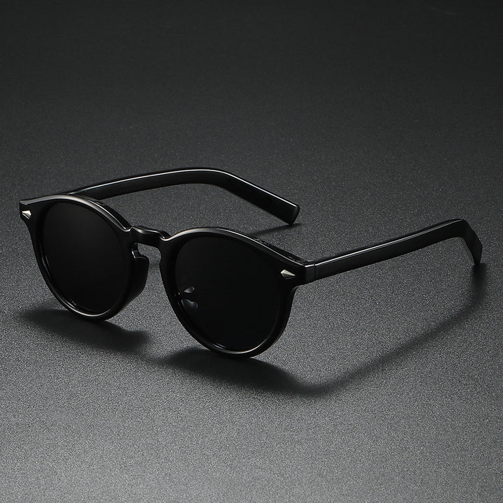 Damen Rund-Sonnenbrille mit transparentem Rahmen und reflektierenden Gläsern Karnz