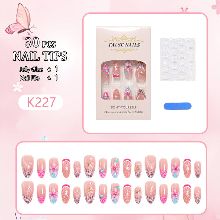 Kunstnagelset mit bunten blühenden 3D-Applikationen Karnz