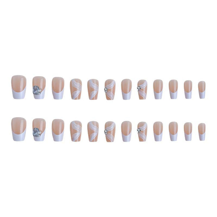 Elegantes Kunstnagelset mit filigranen Verzierungen und Glitzerelementen Karnz