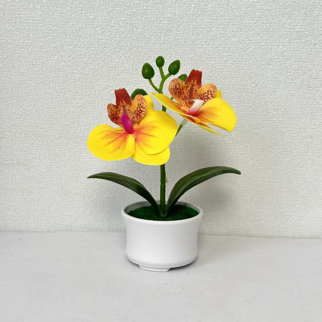 Elegante künstliche Orchideenpflanzenanordnung für die Innendekoration