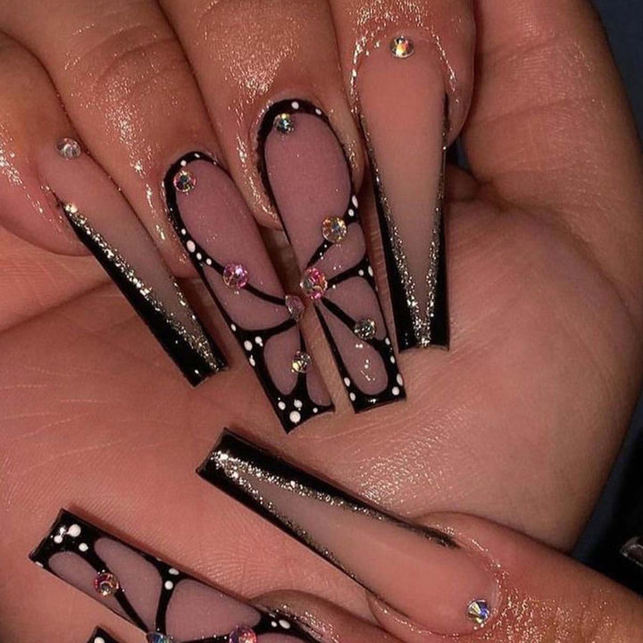 Kunstvolle Stiletto Kunstnägel mit Glitzer- und Schmetterlings-Motiv Karnz