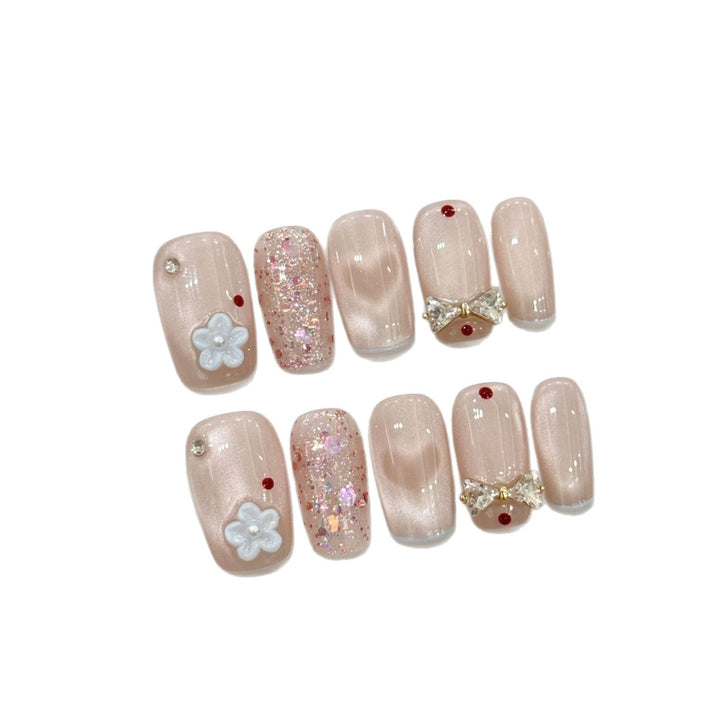 Dekoratives Press-On Nagelkunst-Set mit Glitzer und Schleifenakzenten