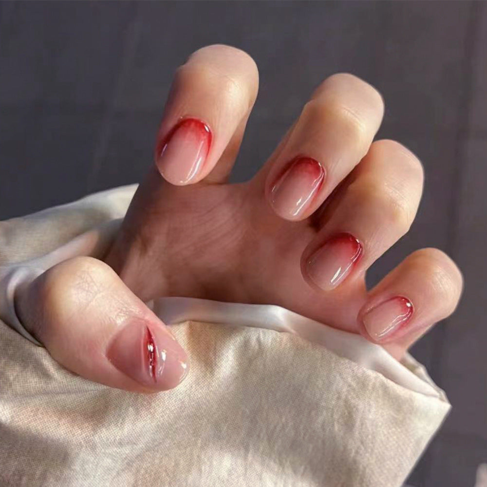Kreative Stiletto-Nagelkunst mit blutroten Akzenten Karnz