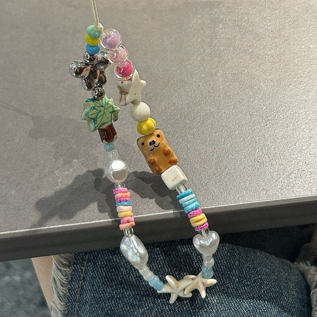 Spielerische thematisierte Perlencharms Eyewear Halskette Karnz