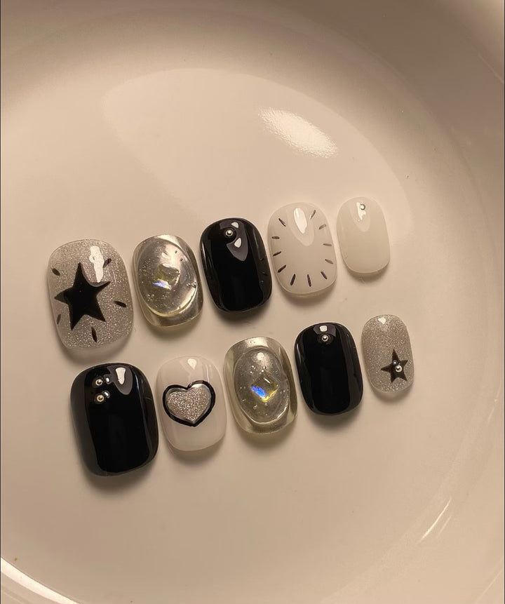Künstlerisches Press-On-Nagelkunstset mit geometrischen und Sternmustern