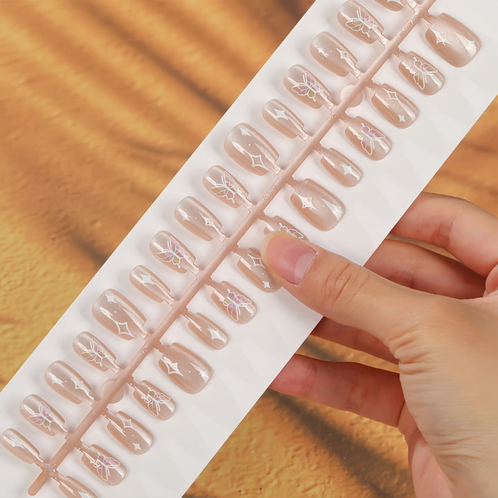 Kunstnägel mit floralem und glitzerndem Design Karnz