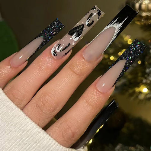 Künstlerisches Langes Stiletto Press-On-Nagelset mit Glitzer und Grafikdesign Karnz