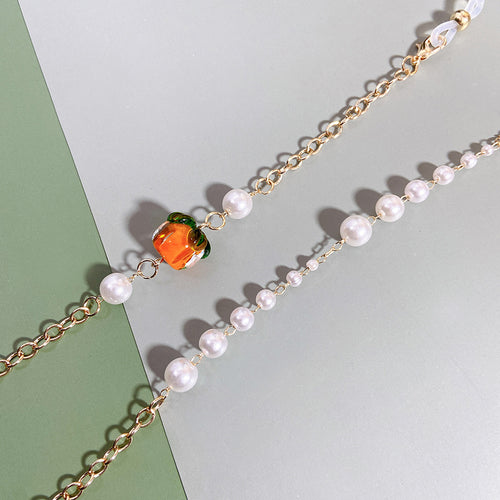 Elegante Kette mit Perlen und Rubinen Karnz
